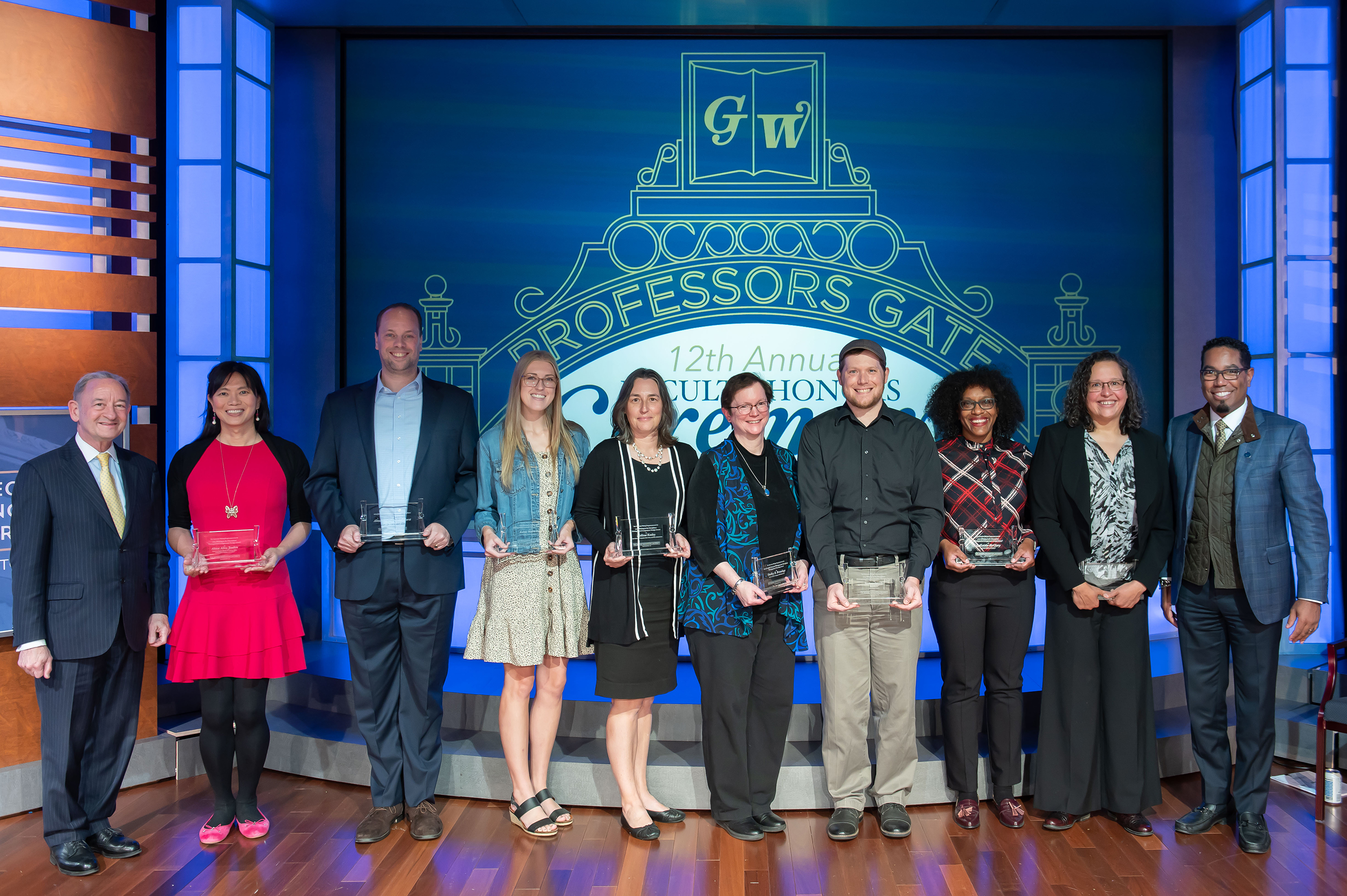 WID Distinguished Teaching Award Winners for 2020, 2021, and 2022, flanked by GW President Mark S. Wrighton (left) and Provost Christopher Bracey (right).