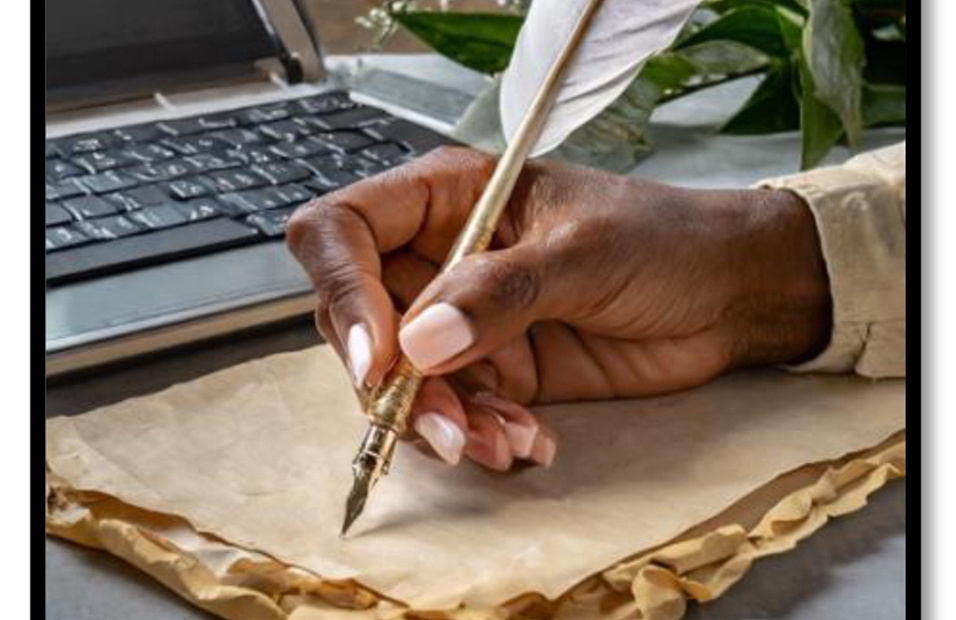 Hand writing on old parchment with feather quill.