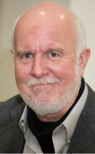 Headshot of Michael Svoboda in a brown jacket.