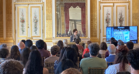 Dr. Rachel Pollack addressing the audience in the Salon Doré at the Pop-Up Exhibition Opening.