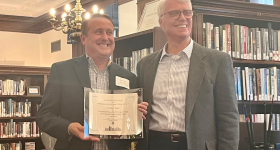 Left to right, Gordon Mantler receiving award; David Burrus, ULCC board member and chair of the library, history & archives subcommittee.